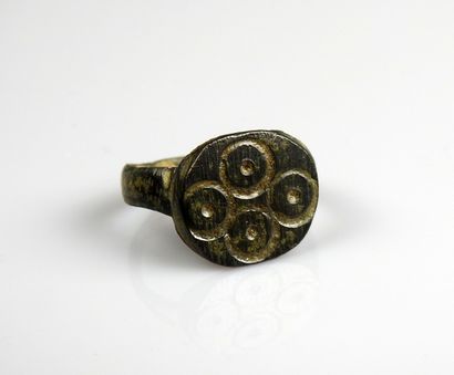 Ring with a decoration of four ocelli 
Bronze....