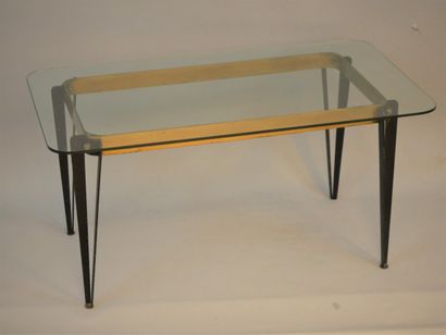 null Gilt metal coffee table, compass legs supporting a glass top, rounded edges....