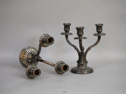 null A pair of silver plated bronze candlesticks with three branches. Height : 21...