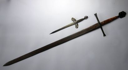 null One and a half hand sword in the XVth century style, wooden shaft covered with...