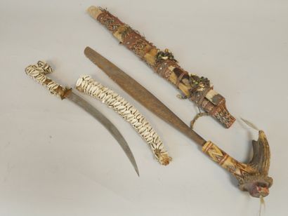 null Set including a dagger covered with cowrie shells (missing), 43cm and a head...