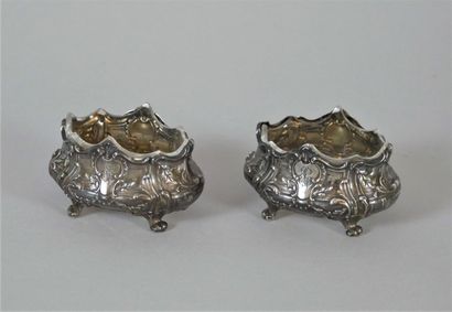 null Pair of silver salt cellars, scrolled feet, decorated with shells and garlands...