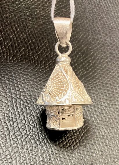 null Two silver pendants with openwork designs in the shape of a pompom and a house....