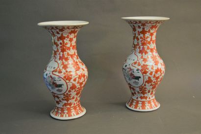null Pair of polychrome porcelain horn vases decorated with lettered figures in

reserves...
