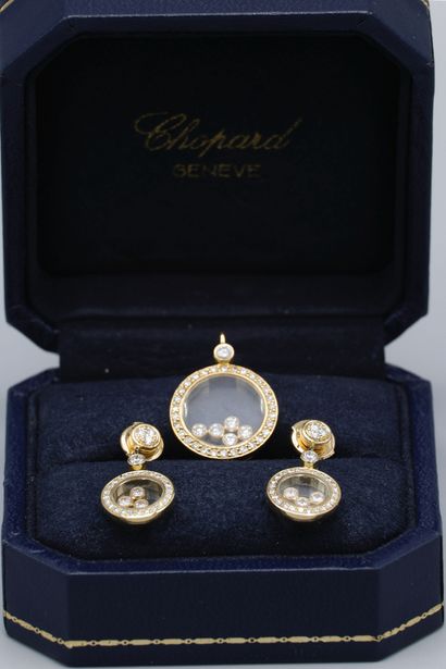 null CHOPARD. HAPPY DIAMONDS. Pendant and pair of earrings in 18K yellow gold, consisting...