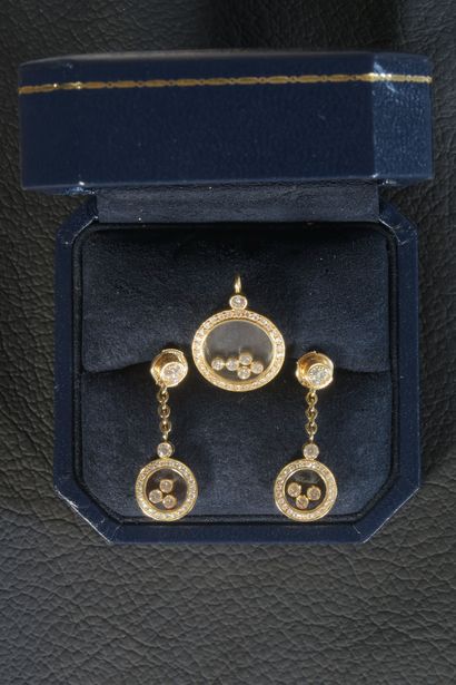 null CHOPARD. HAPPY DIAMONDS. Pendant and pair of earrings in 18K yellow gold, consisting...