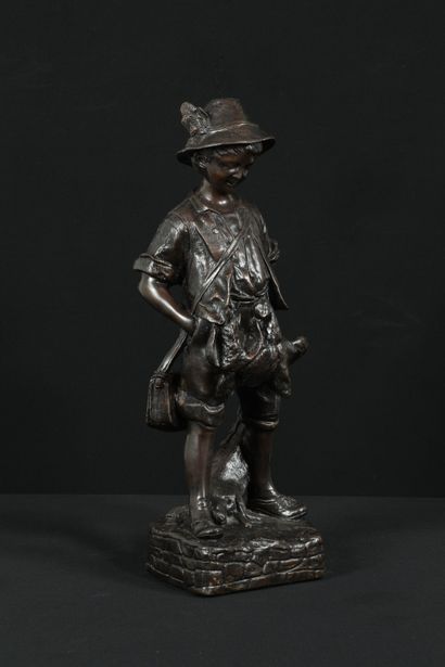 null A dark patina bronze sculpture representing a child hunter. Illegible signature...