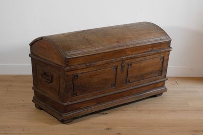 null Carved oak chest with moulded frame and flower spandrels. It rests on four square...