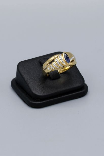 null Ring in 18K yellow gold, set with a navette sapphire and paved with small brilliant-cut...