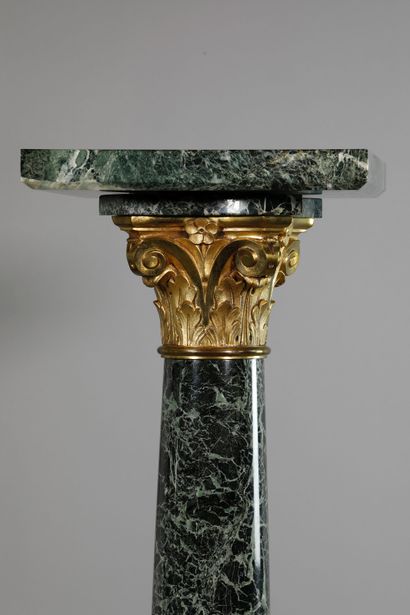 null A sculpted sea-green marble saddle or column with a Corinthian capital decorated...