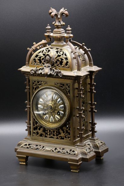 null A Neo-Renaissance patinated bronze clock with a bronze dial and enamelled

with...