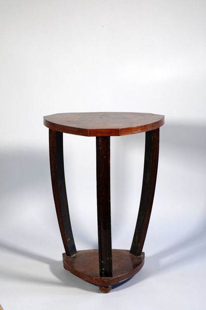 null Rosewood and veneer pedestal table with 3 cut sides, tripod base joined by a...