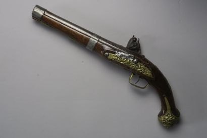 null Flintlock pistol with wooden stock, carved barrel and lock, all brass fittings...