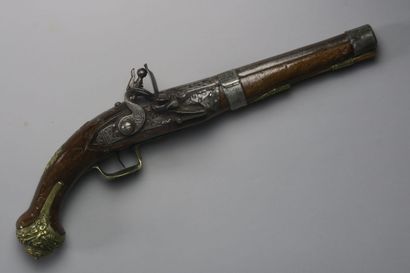 null Flintlock pistol with wooden stock, carved barrel and lock, all brass fittings...