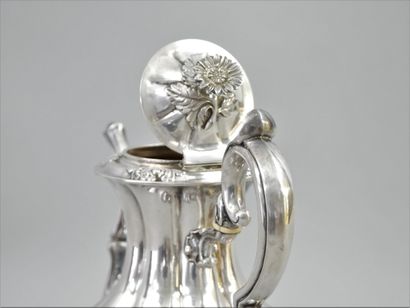 null Silver embossed teapot with a scrolled handle and ivory ferrules; a scrolled...