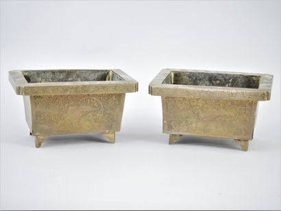 China, 20th century. A pair of chased bronze...