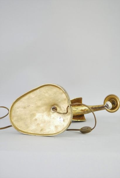 null A bird-shaped gilt bronze lamp, the ovoid base decorated with stylized oak leaves....