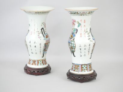 null China, late 19th century. Pair of polychrome enamelled porcelain baluster vases...