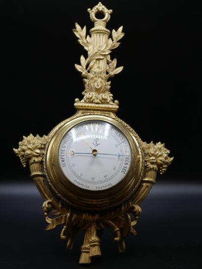 Gilt bronze barometer with white and black...