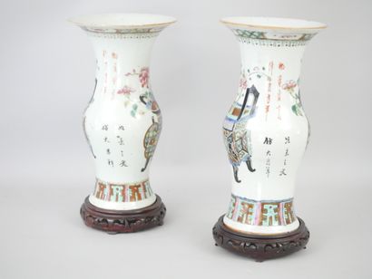 null China, late 19th century. Pair of polychrome enamelled porcelain baluster vases...