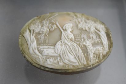 null Shell cameo representing a shepherdess and a sheep in front of a village. Period...