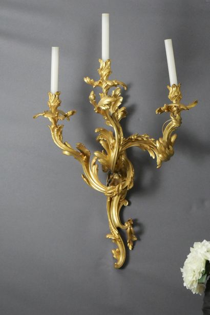 null Important Pair of three arms gilt bronze sconces decorated with scrolls of foliage....