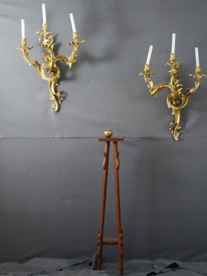 null Important Pair of three arms gilt bronze sconces decorated with scrolls of foliage....