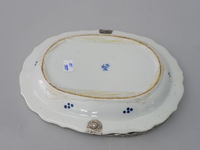 null Oval earthenware dish enamelled blue white with decoration of foliage, mounting

with...