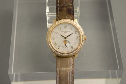 null 
PATEK PHILIPPE. Lady's watch in 18K yellow gold, mother-of-pearl dial with...