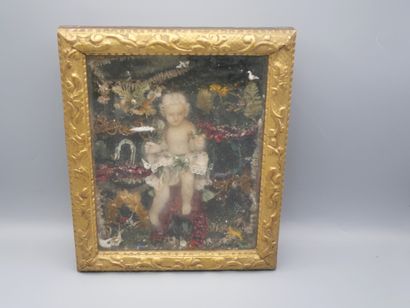 null DIORAMA featuring the Infant Jesus in a plant and mineral environment.
The Child...