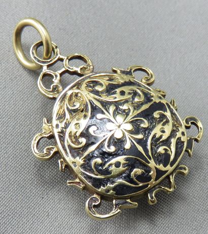 null Pendant in gold 750°/00 
 partially enameled, decorated with a stone stylizing...