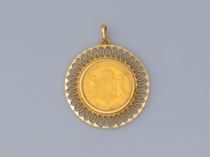 null Coin-holder pendant in 750°/00 gold adorned with a 20-crown coin in 900°/00...