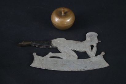 null Painted iron chopper (butcher's leaf) depicting a semi-recumbent woman smoking....