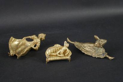 null Lot of three erotic bronze subjects, modern recasts:
-Young woman on sofa.
-Cancan
-Ashtray...