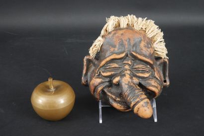 null Grotesque mask in patinated plaster with phallic nose.
Straw hair.
Height: 16...