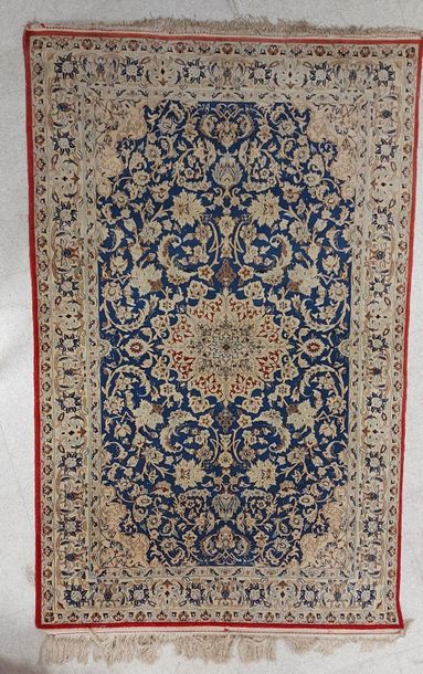 null NAÏM CHICHLA RUG (Iran) in wool and silk with medallion decoration on a blue...