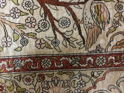 null THIN HEREKE RUG (TURKEY) in silk decorated with trees, animals and birds on...