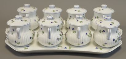 SUITE of 8 cream pots and their tray in porcelain...