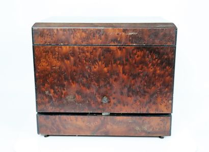 null A burl veneer liquor cabinet, the lid decorated with a cartouche.

It includes...