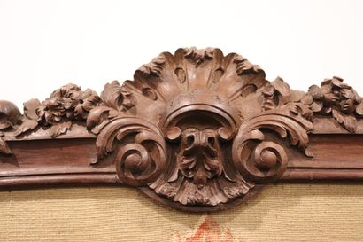 null Molded and carved wood fire screen with rocaille decoration.

Floral tapestry...