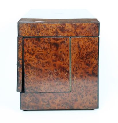 null A burl veneer liquor cabinet, the lid decorated with a cartouche.

It includes...