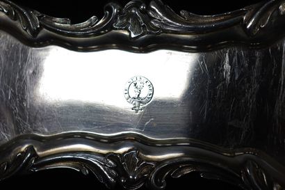 null A silver platter with rocaille decoration, the tray decorated with a stag with...