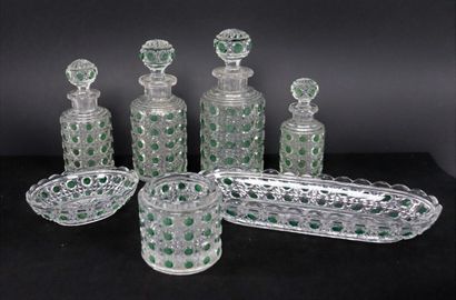null BACCARAT.

Toilet set in crystal partially tinted green, including four bottles,...