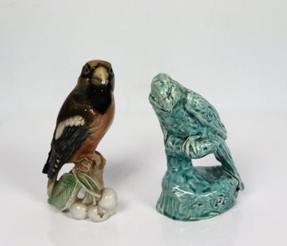 null Two enamelled porcelain birds, one with blue glaze, the other with polychrome...