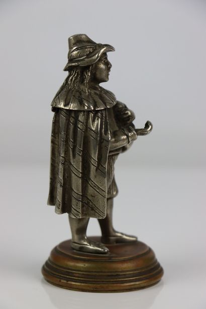 null A partially silvered bronze inkwell or pyrogen, representing a bagpiper.

19th...
