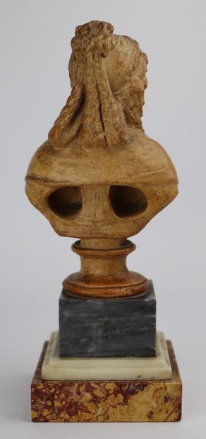 null Woman with headband.

Bust in patinated terracotta, resting on a base made of...