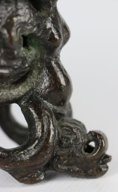 null ITALY.

Inkwell in old bronze, the catch decorated with a triton, the feet formed...