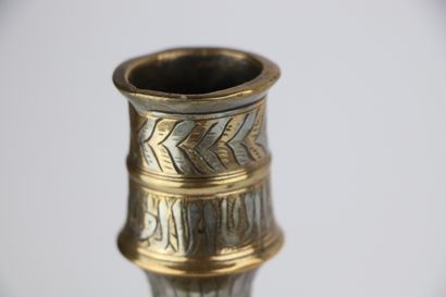 null Brass and silver candlestick, in the style of Mamluk productions.

Ancient work.

H_24...