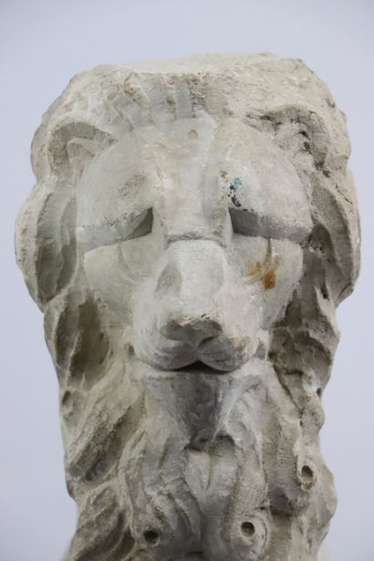 null Carved stone element representing a sitting lion.

H_39 cm W_12 cm D_18 cm