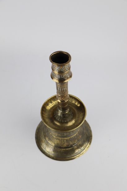 null Brass and silver candlestick, in the style of Mamluk productions.

Ancient work.

H_24...